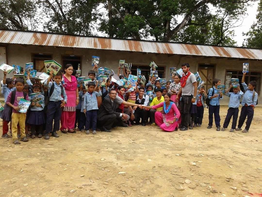 Children and volunteers outside a school